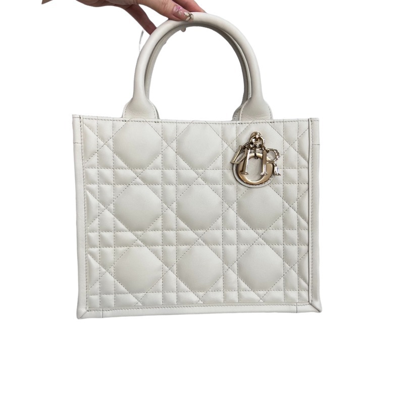 The medium-sized Dior Book Tote in quilted, also known as the "Dior quilted tote bag," is a leather upgrade of the classic Book Tote.