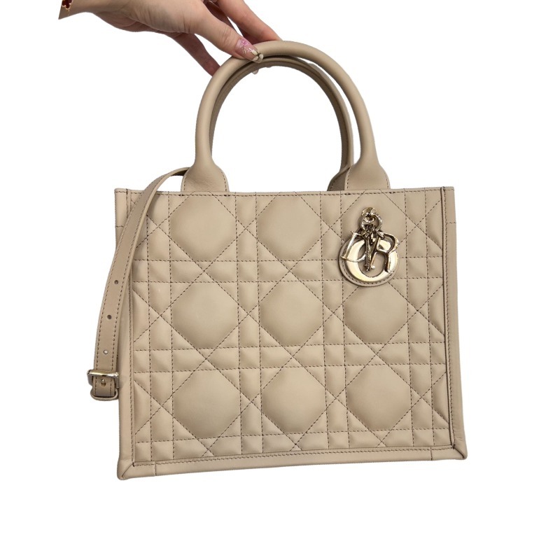 The medium-sized Dior Book Tote in quilted, also known as the "Dior quilted tote bag," is a leather upgrade of the classic Book Tote.