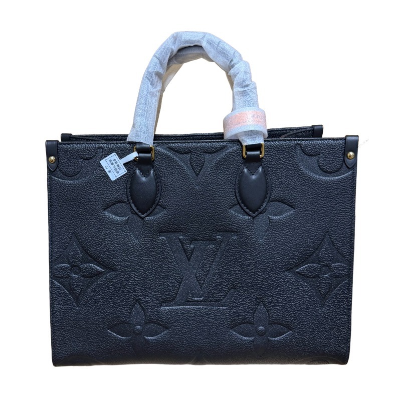 The Louis Vuitton Onthego MM tote bag, featuring an all-black version crafted from embossed Monogram Empreinte cowhide.