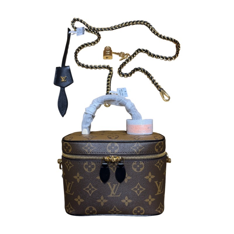 The Louis Vuitton Vanity Small Handbag (Cosmetic Case Style) features the classic Monogram canvas paired with gold-tone hardware.