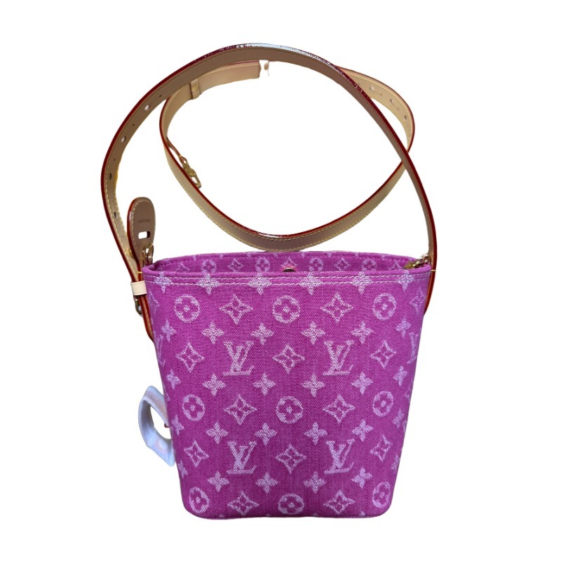 The Louis Vuitton Vanity Small Handbag (Vanity Case style) is crafted from the brand's classic Monogram-printed pink denim canvas, accented with natural cowhide trim and gold-tone hardware.