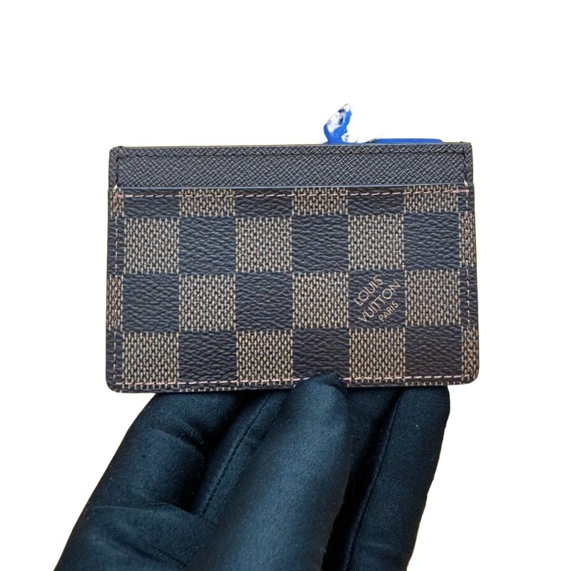 The Louis Vuitton Damier Ebene Card Holder (Model N61722) is one of the brand's classic entry-level leather goods.