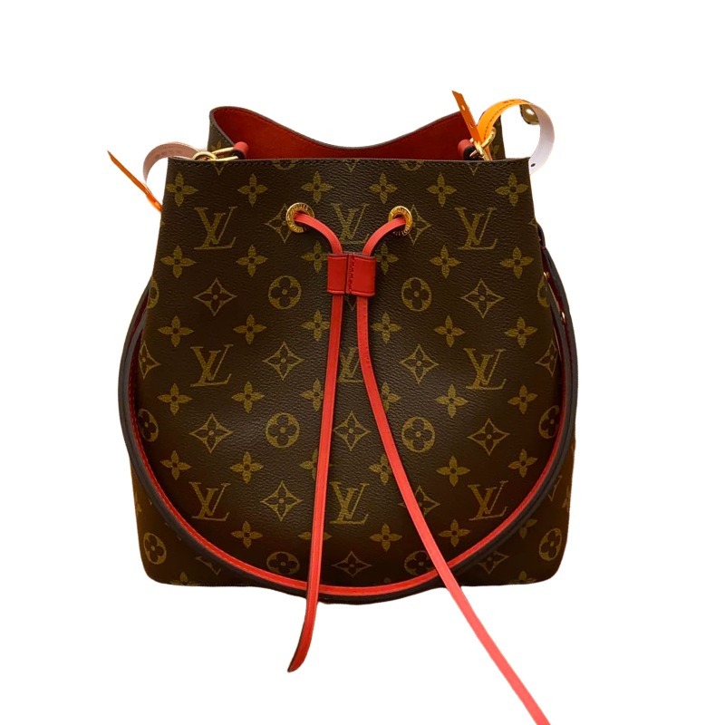 The Louis Vuitton NéoNoé MM bucket bag features the classic Monogram canvas, paired with a vibrant red lining and drawstring.