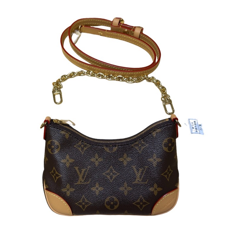 The Louis Vuitton LV Mini Hobo—often referred to as the "Moon Bag"—is crafted from the brand's classic Monogram canvas.