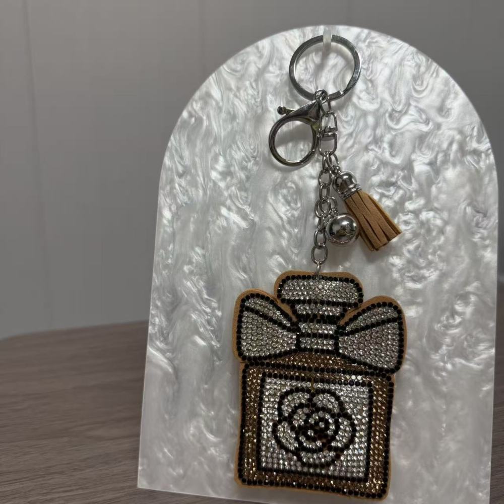 Brown perfume keychain