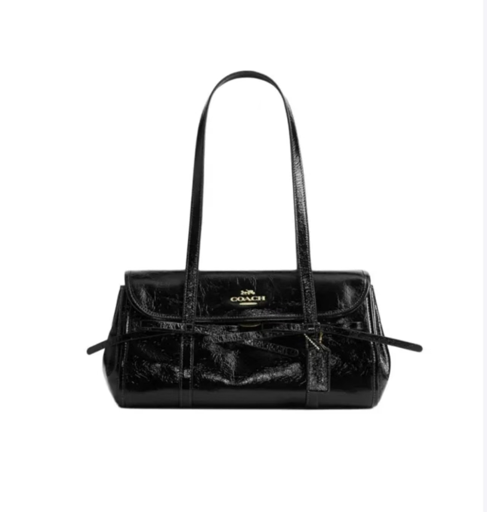 COACH Bridget 34 large black women’s shoulder bag featuring a bow accent, classic gold-tone logo, and smooth pebbled leather.