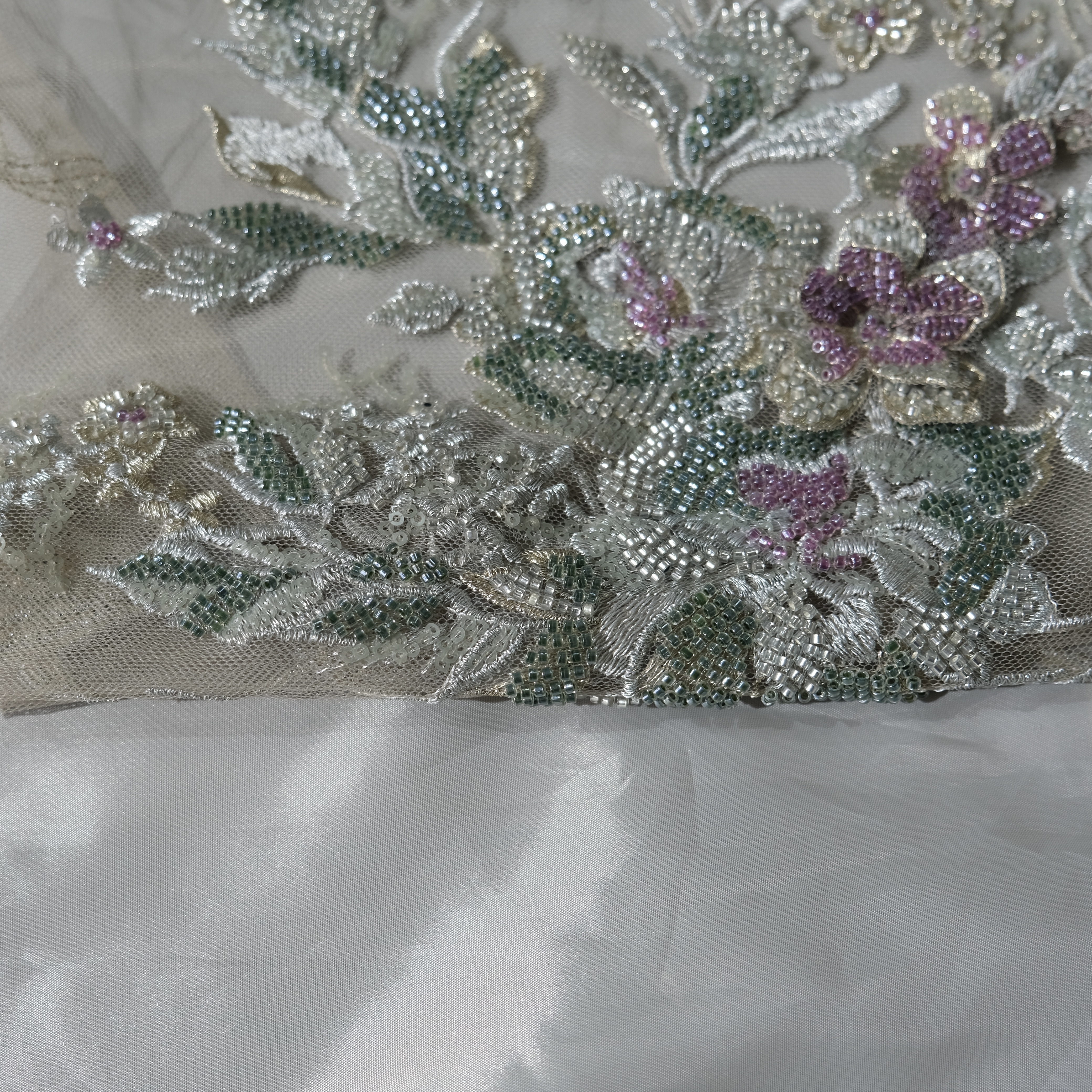 Bouquet Embroidery Fabric in GreenPurple color