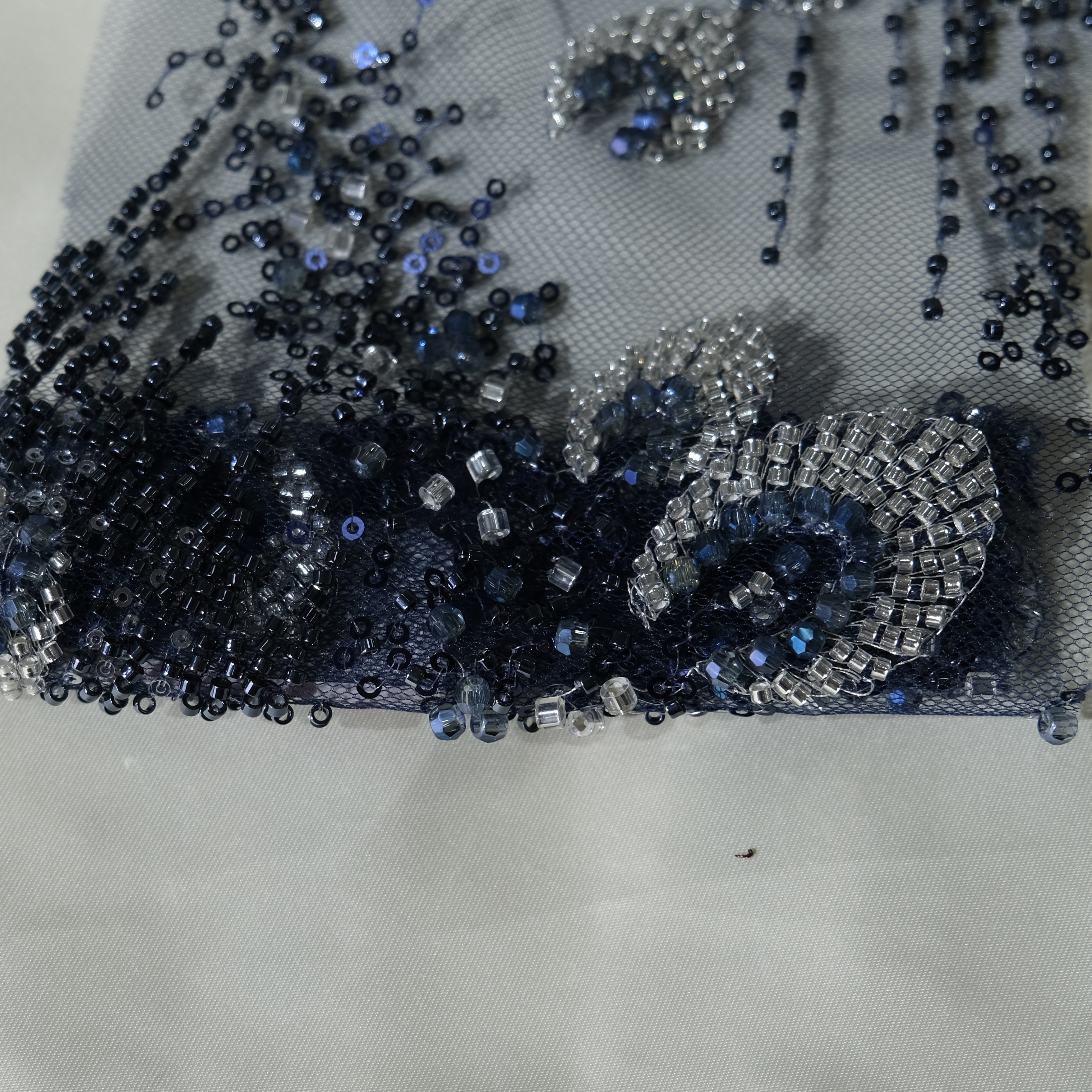 Whirl Bloom Embroidery Fabric in Navy color