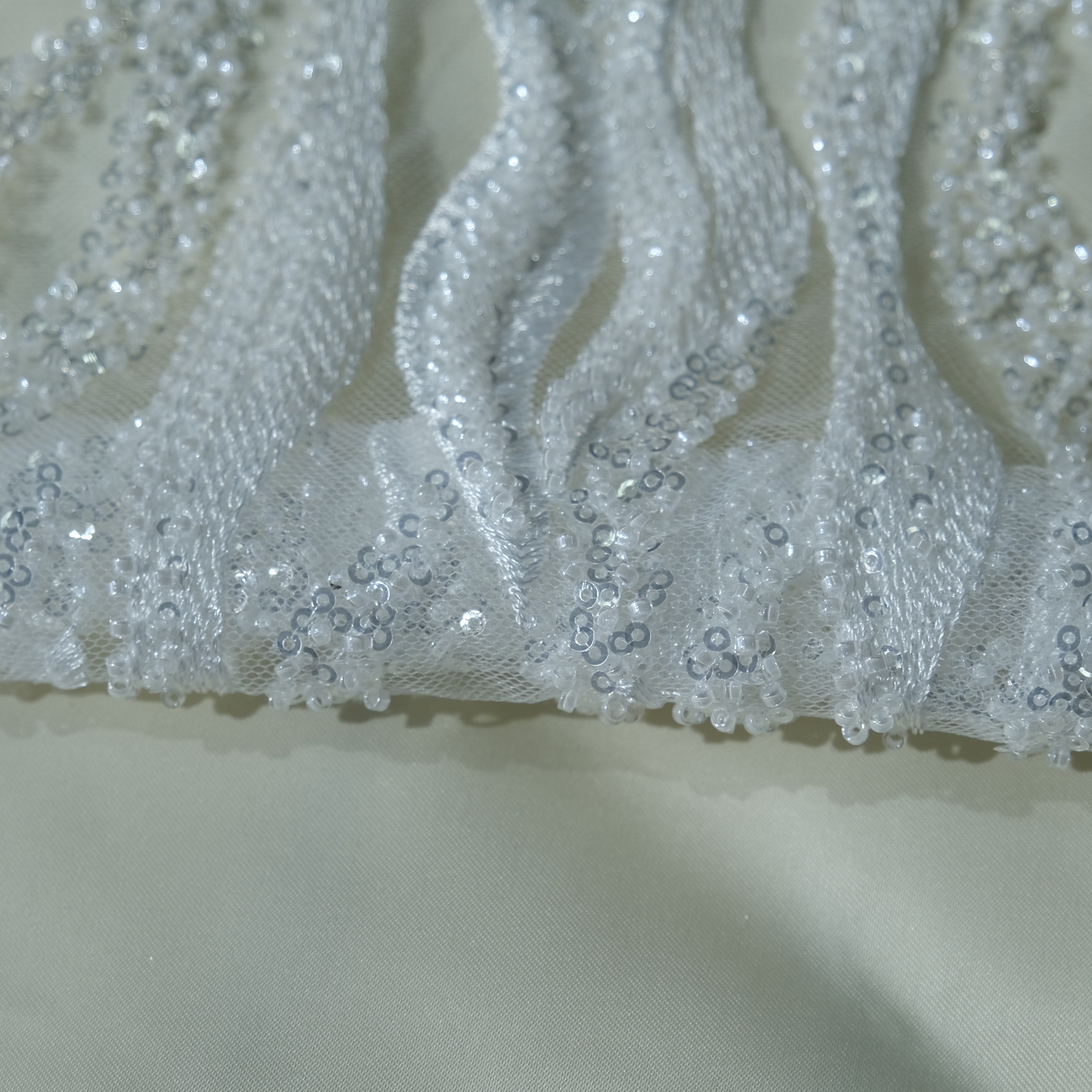 Flowing Flame Embroidery Fabric in RawWhite color