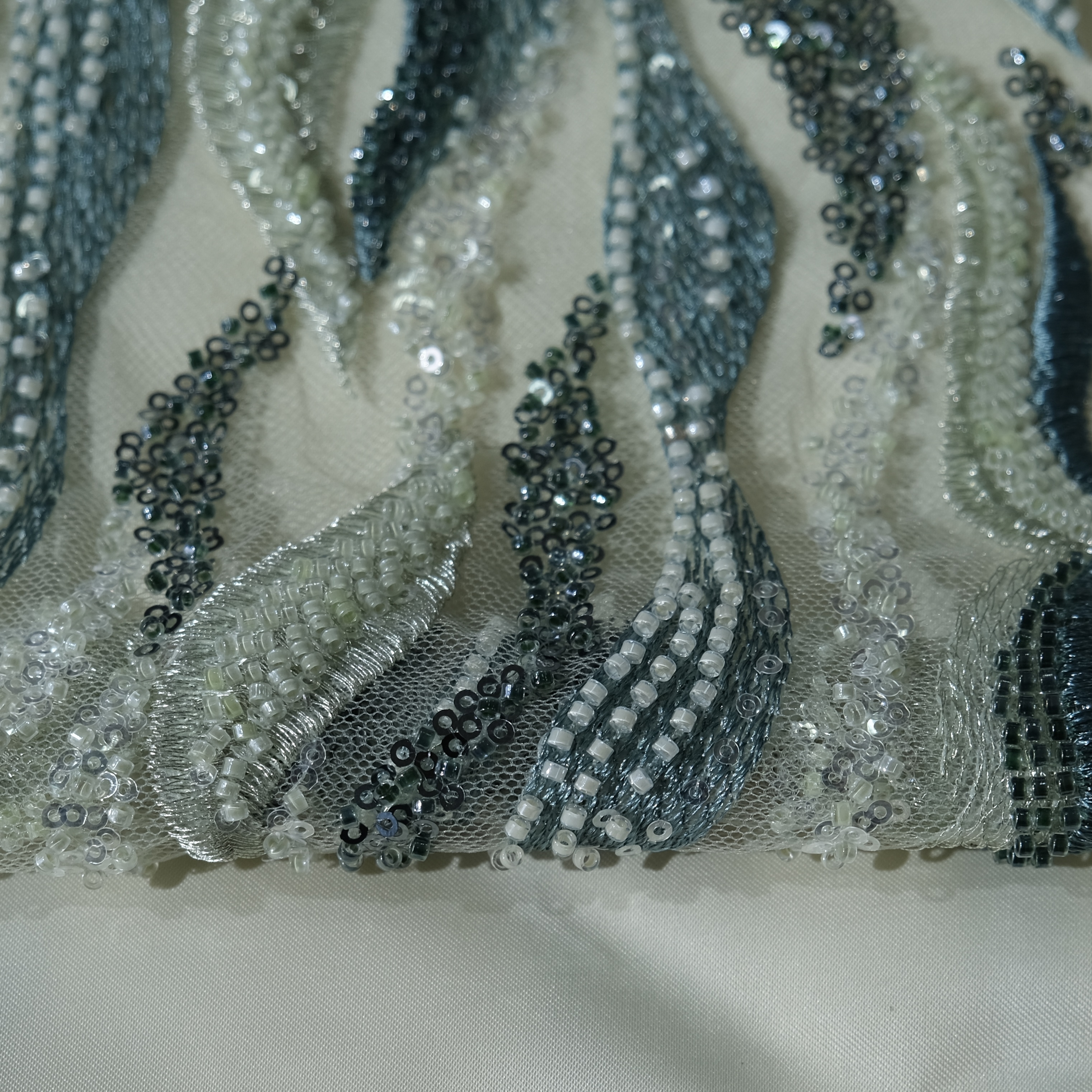 Flowing Flame Embroidery Fabric in LightGreen color