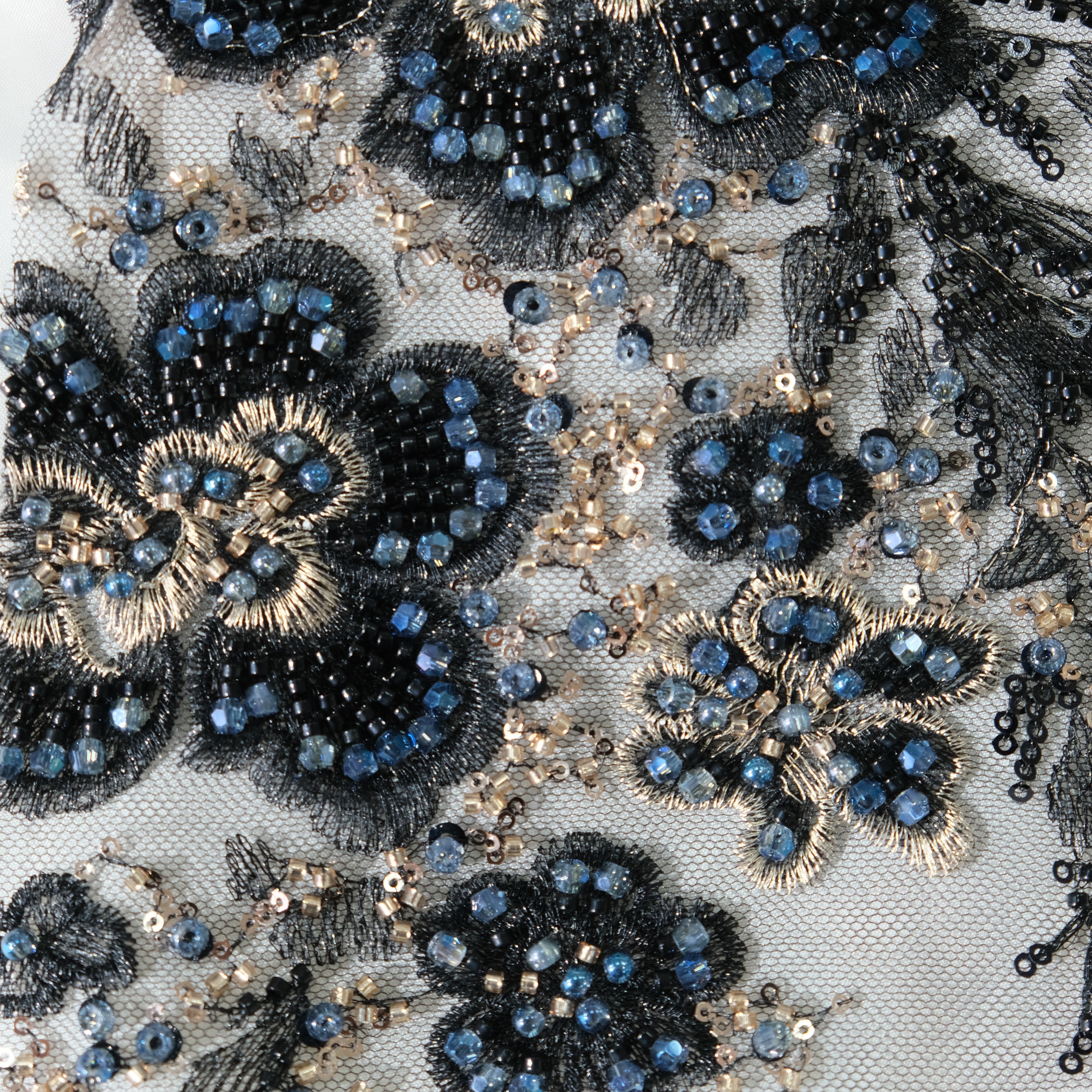 Radiant Floral Embroidery Fabric in BlackGolden color