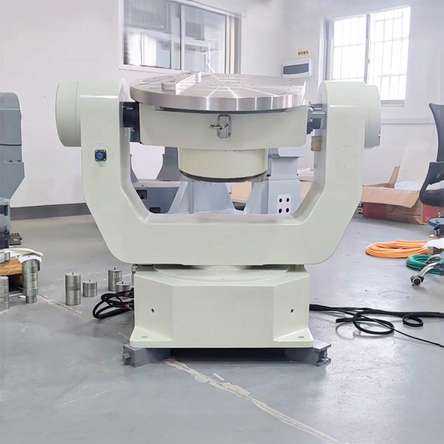Size comparison of three axis inertial navigation test table with industrial robot arm