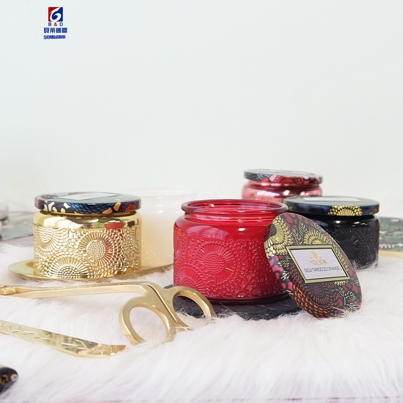An Empty Jar Of Colored Scented Candles