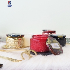 An Empty Jar Of Colored Scented Candles