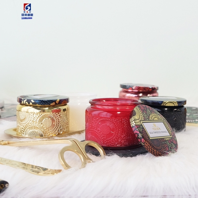 An Empty Jar Of Colored Scented Candles
