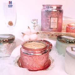 An Empty Jar Of Colored Scented Candles