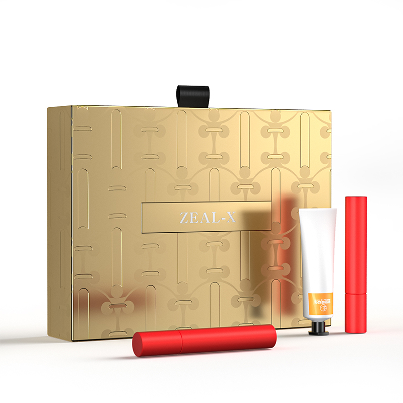 Zeal-X gold rigid cosmetic gift box displayed with lipstick, lip balm and serum tube