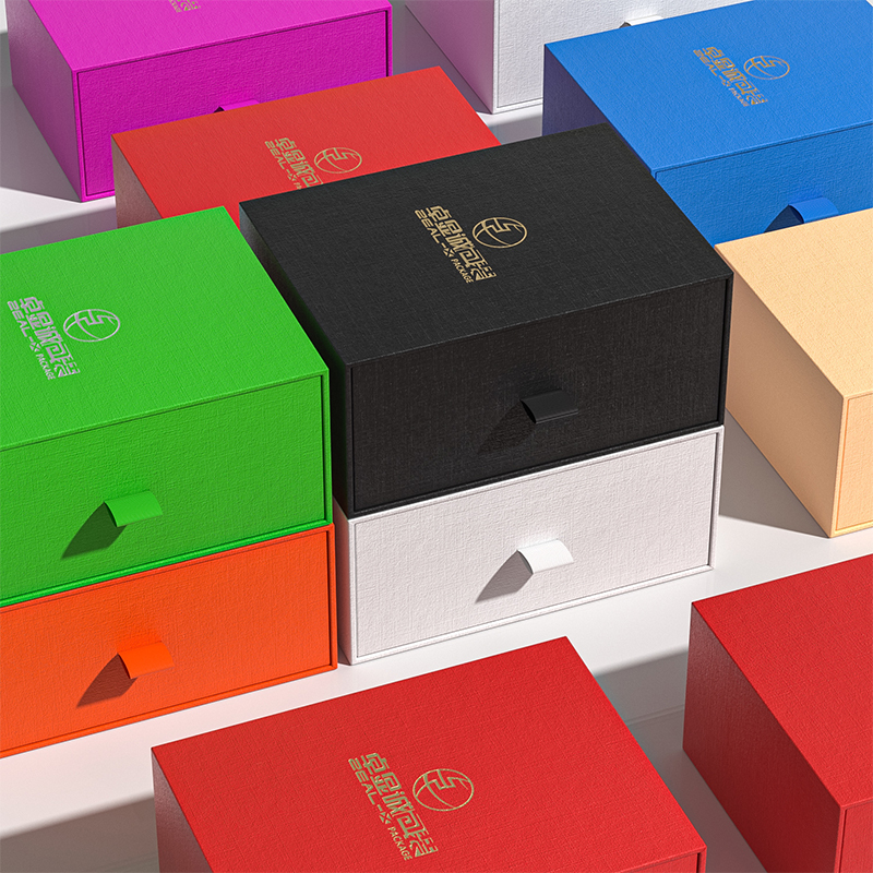 Assortment of colorful custom perfume drawer boxes in red, green, blue, pink, black and white.