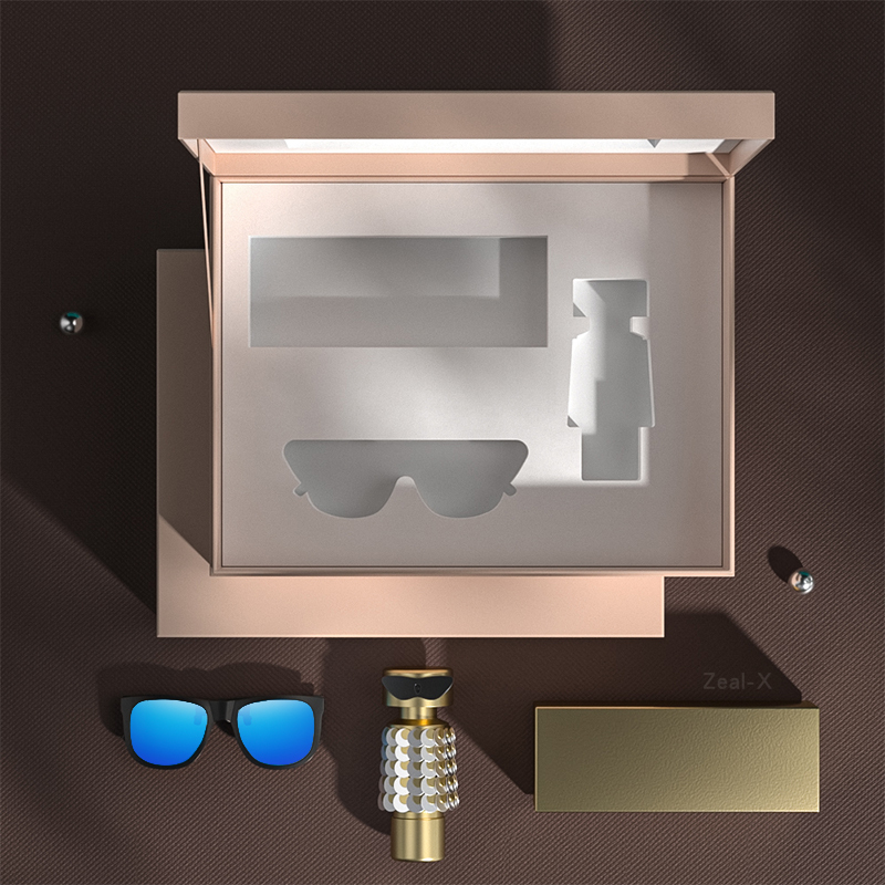 Top view of an open hinged gift box with custom-cut EVA cavities for three beauty and eyewear products