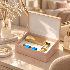 Luxury hinged gift box for perfume, sunglasses and sunscreen displayed in a warm beauty setting