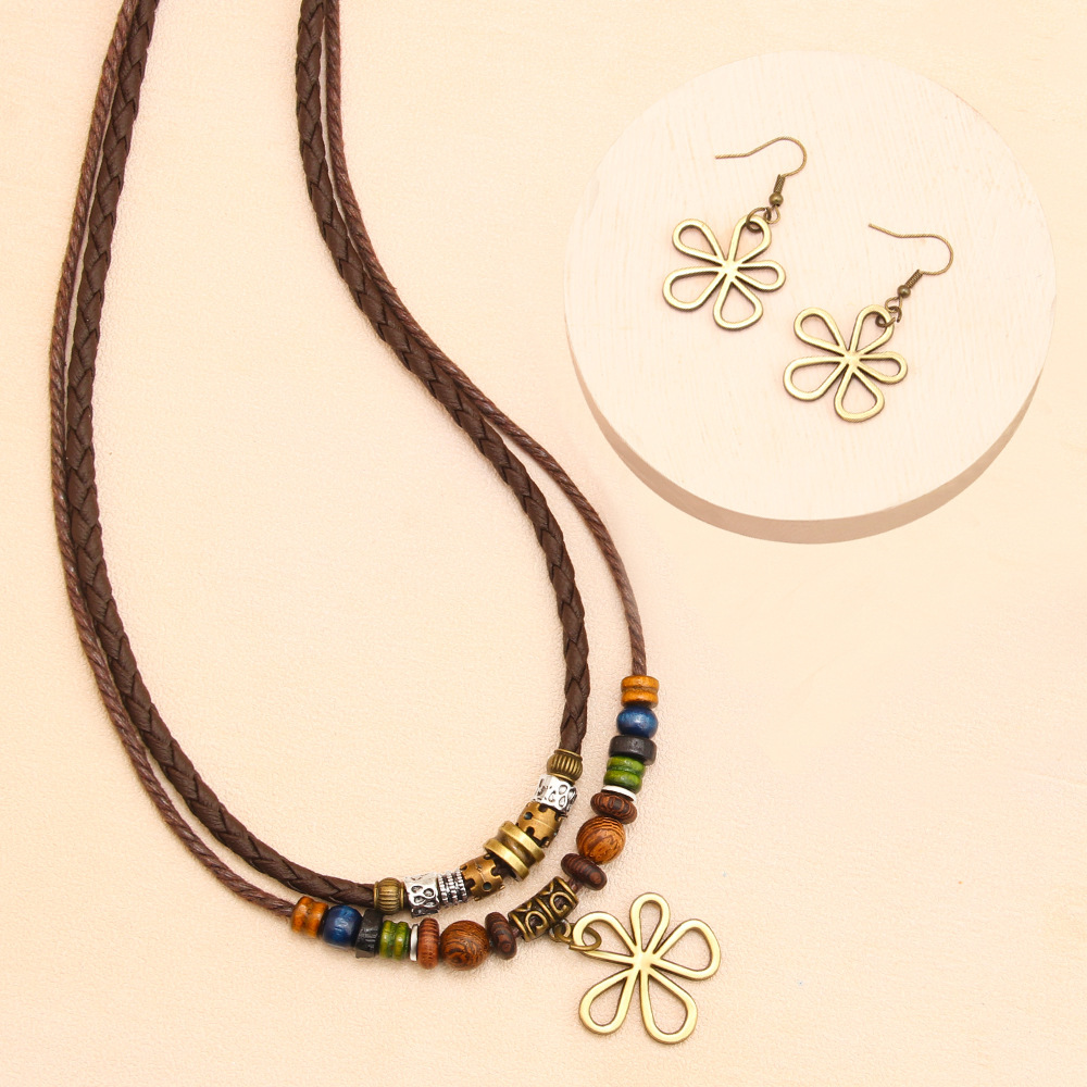 Trendy distinctive five-leaf clover beaded wax cord necklace/sweater chain and matching earrings set—a hot-selling fashion item