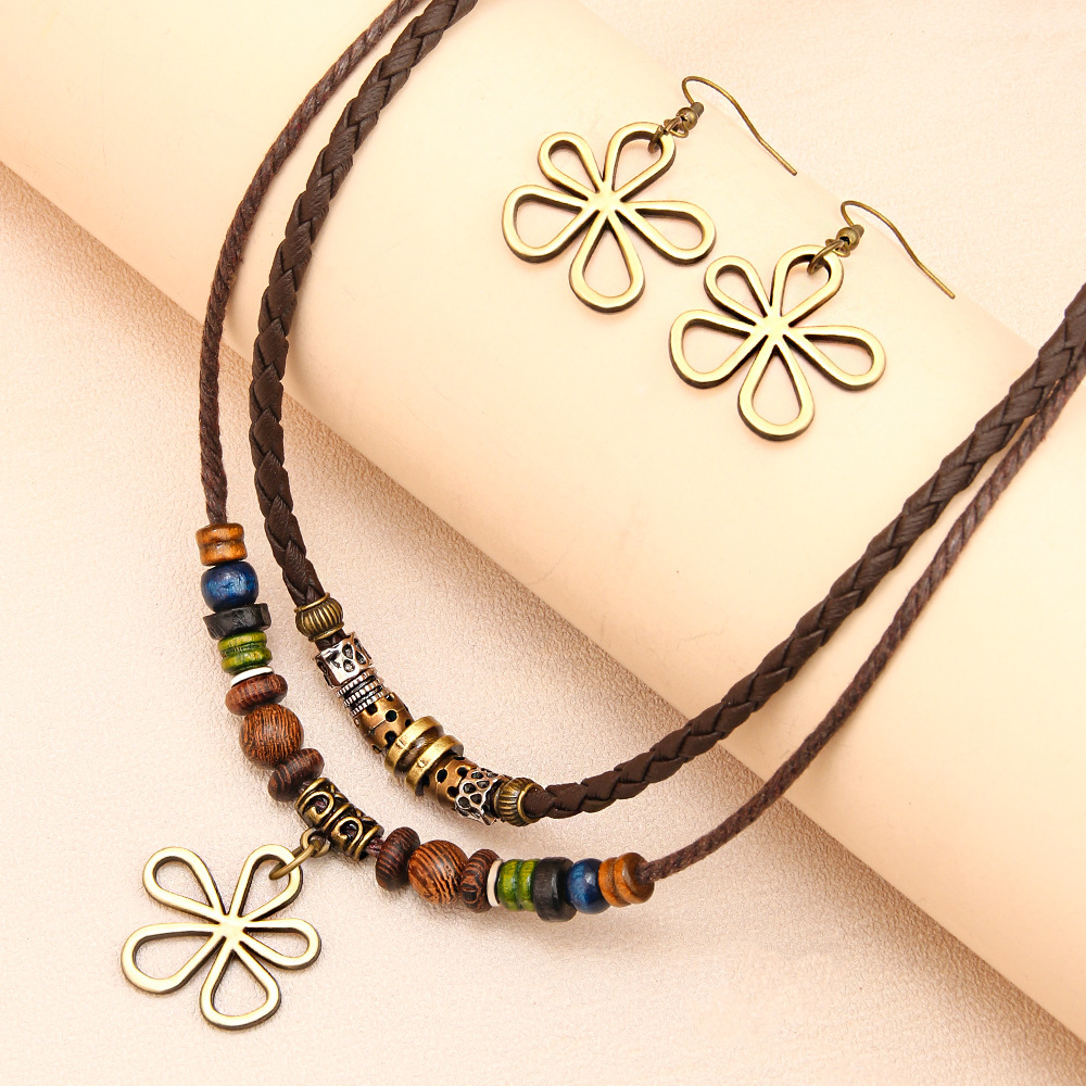 Trendy distinctive five-leaf clover beaded wax cord necklace/sweater chain and matching earrings set—a hot-selling fashion item