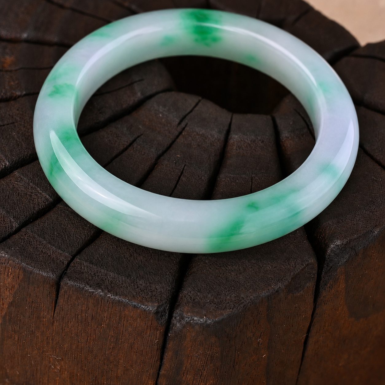 Fine-textured Semi-translucent White Jadeite Bangle with Vibrant Green Patches