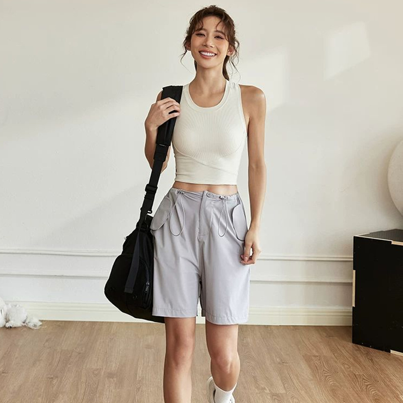 Light gray women's sports vest can be worn externally