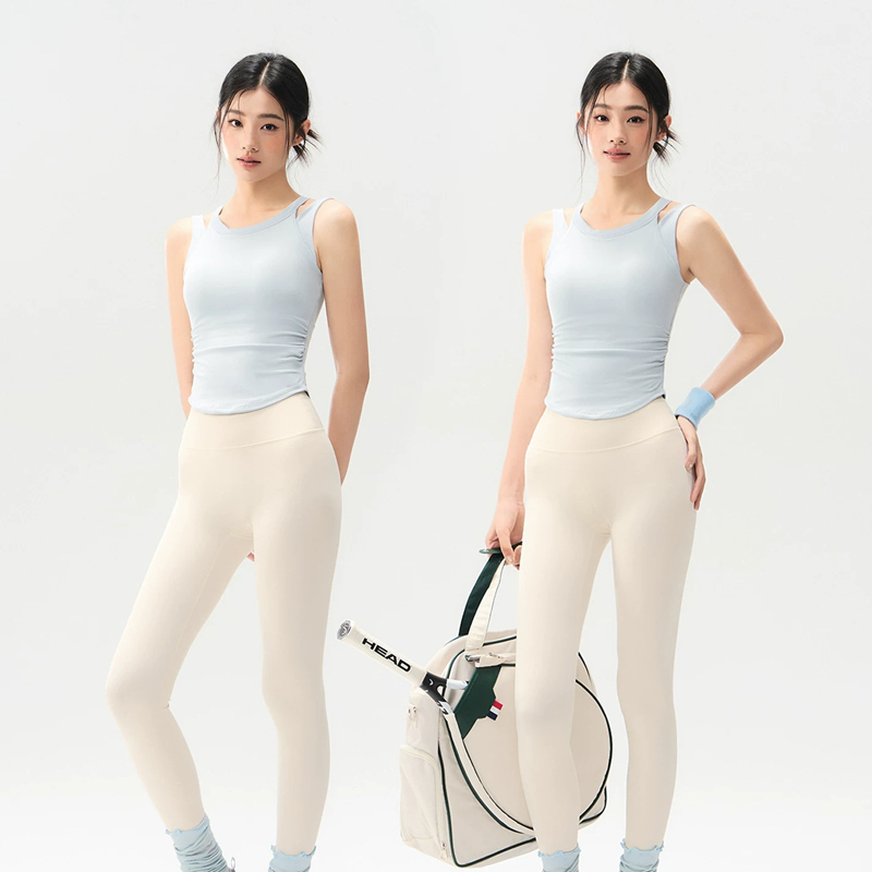 Light blue women's sports vest with shoulder straps can be worn externally