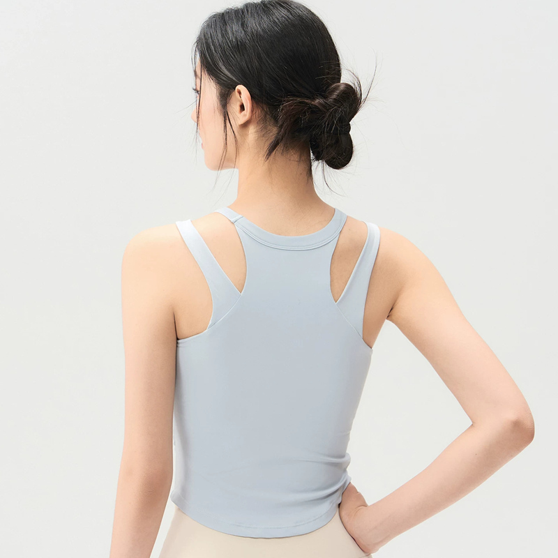 Light blue women's sports vest with shoulder straps can be worn externally