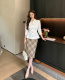 Elegant blouse decorated with iconic interlocking GG gold buttons.