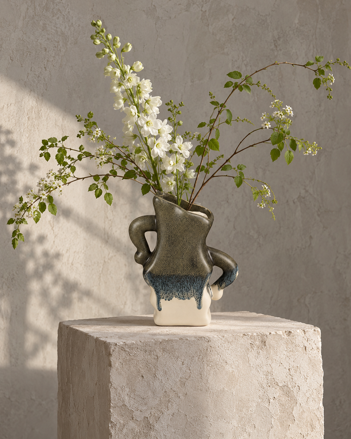 ATW-S252342-B sculptural wave charcoal drip stoneware floral vessel with botanical arrangement in styled interior