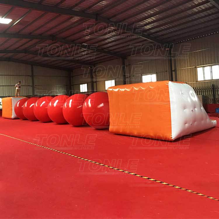 big red inflatable ball obstacle water games
