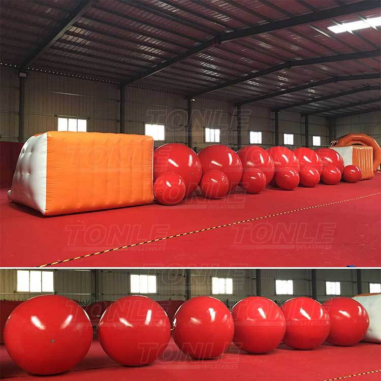 big red inflatable ball obstacle water games
