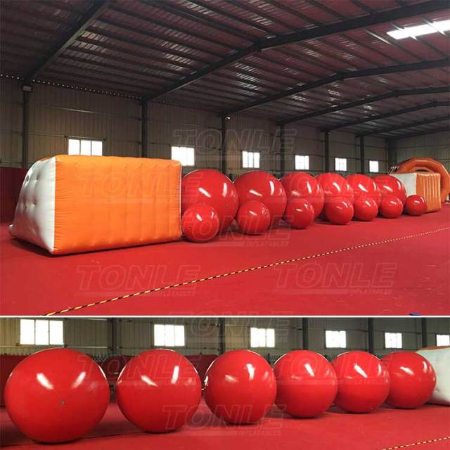big red inflatable ball obstacle water games