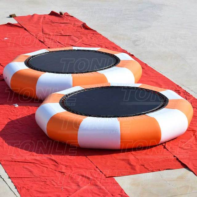 cheap inflatable floating water trampoline with slide