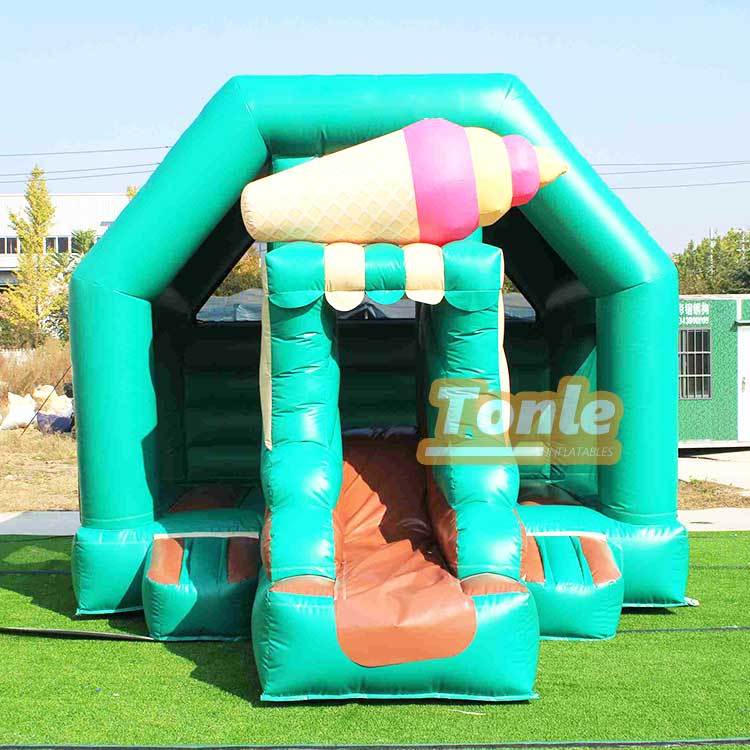 Ice cream themed bouncy castle with slide