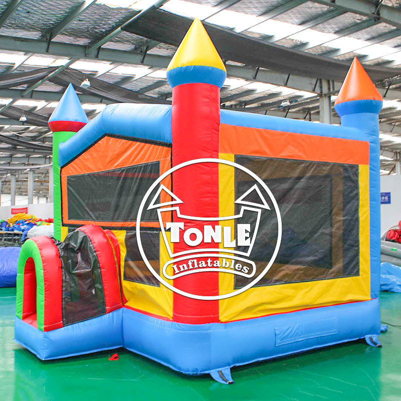 Classic red, yellow and blue castle-style inflatable bounce house for sale