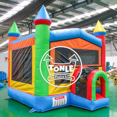 Classic red, yellow and blue castle-style inflatable bounce house for sale