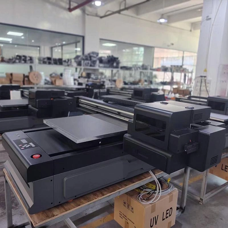 cosmox-6090-uv-flatbed-printer-side-view-at-factory