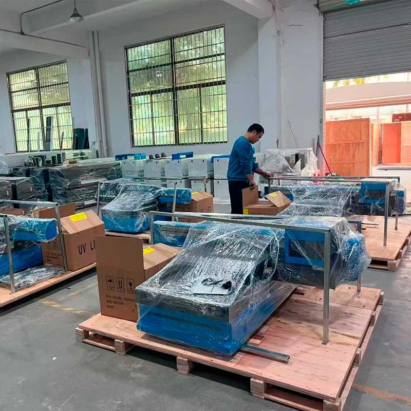 4 sets cosmox 6090 uv flatbed printer during packing in workshop