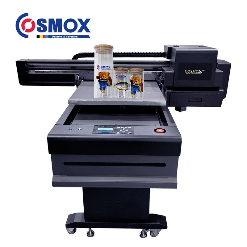 cosmox-6090-uv-flatbed-printer-front-view-with-printed-water-bottles