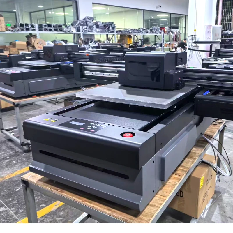 2 sets Cosmox 6090 uv printer at work shop