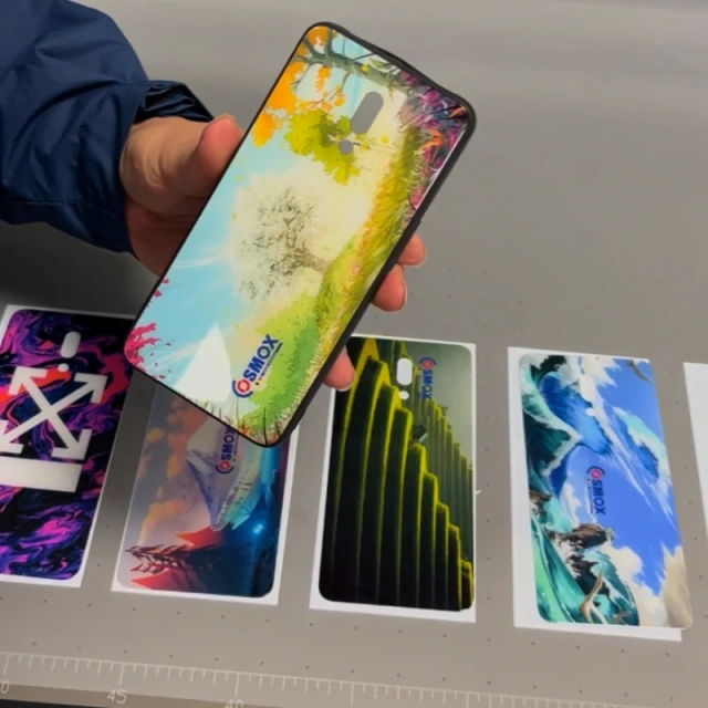 cosmox 6090 uv flatbed printer with printed phone cases samples