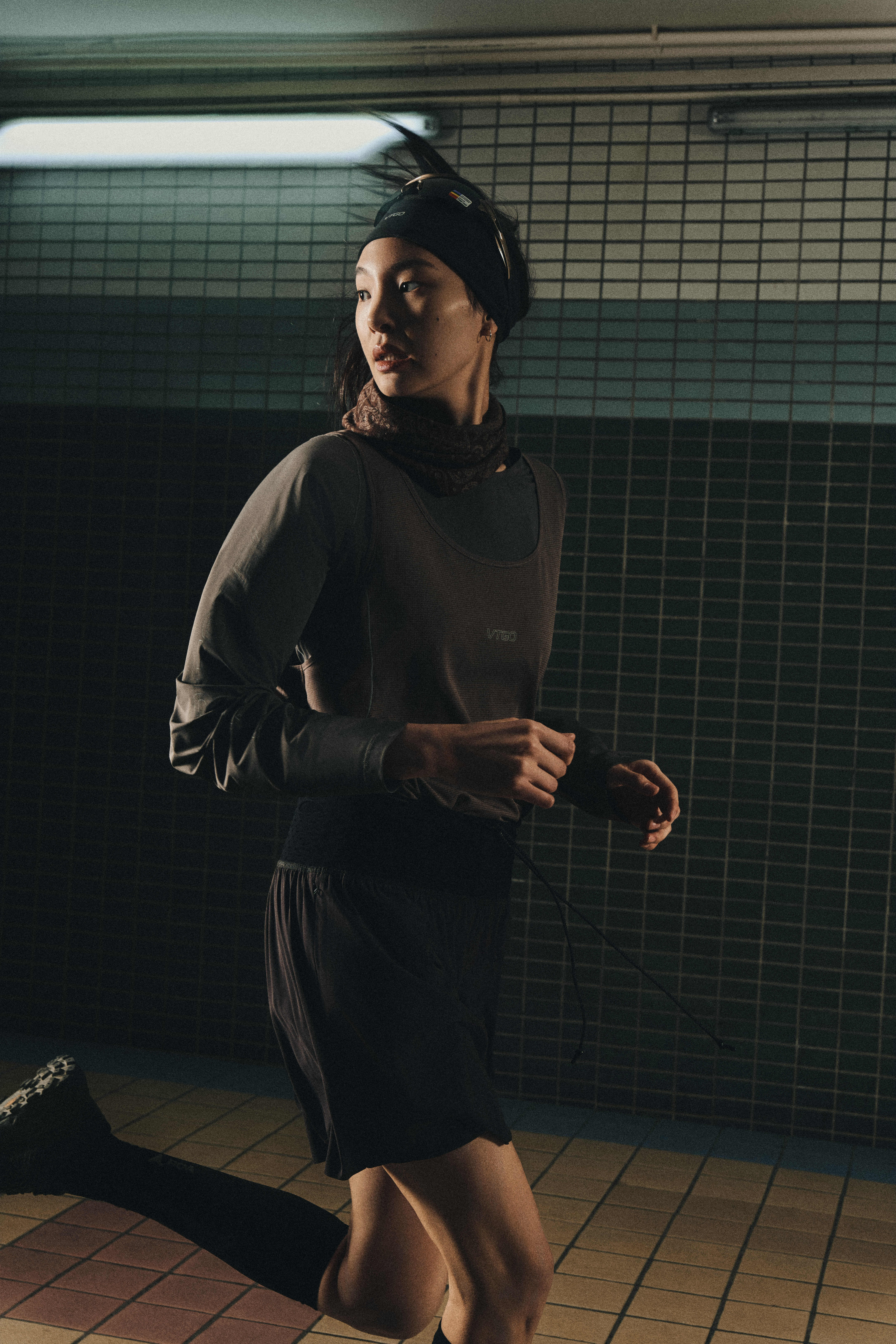 FW25 Campaign — Runners crossing alpine meadow