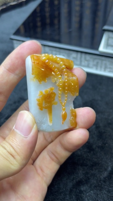 A scroll of scriptures tilts, a thought enters meditation The Dhamakan yellow jade shows a charming colour
