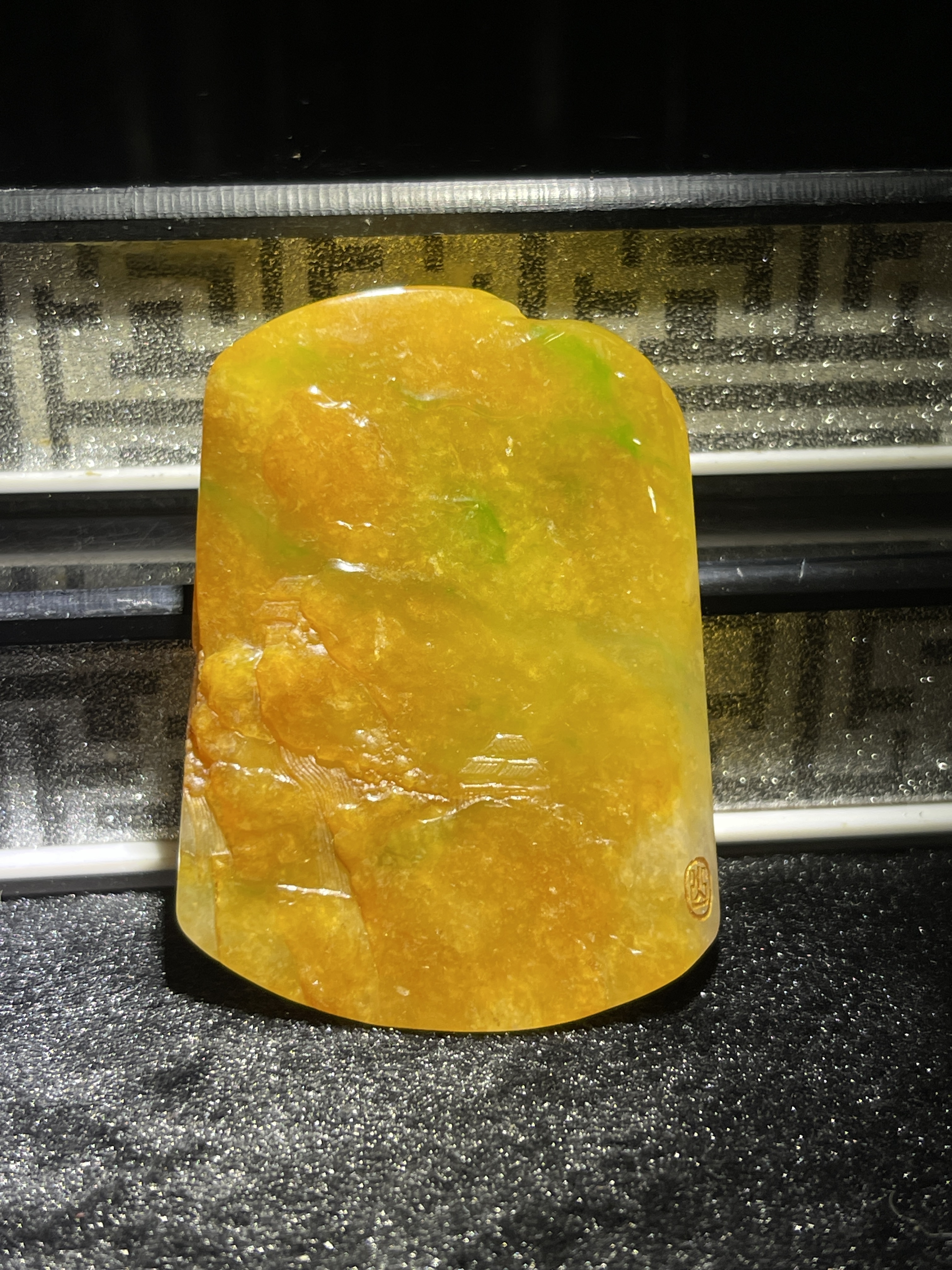 Yellow and green tri-colour jade Caishen amulet