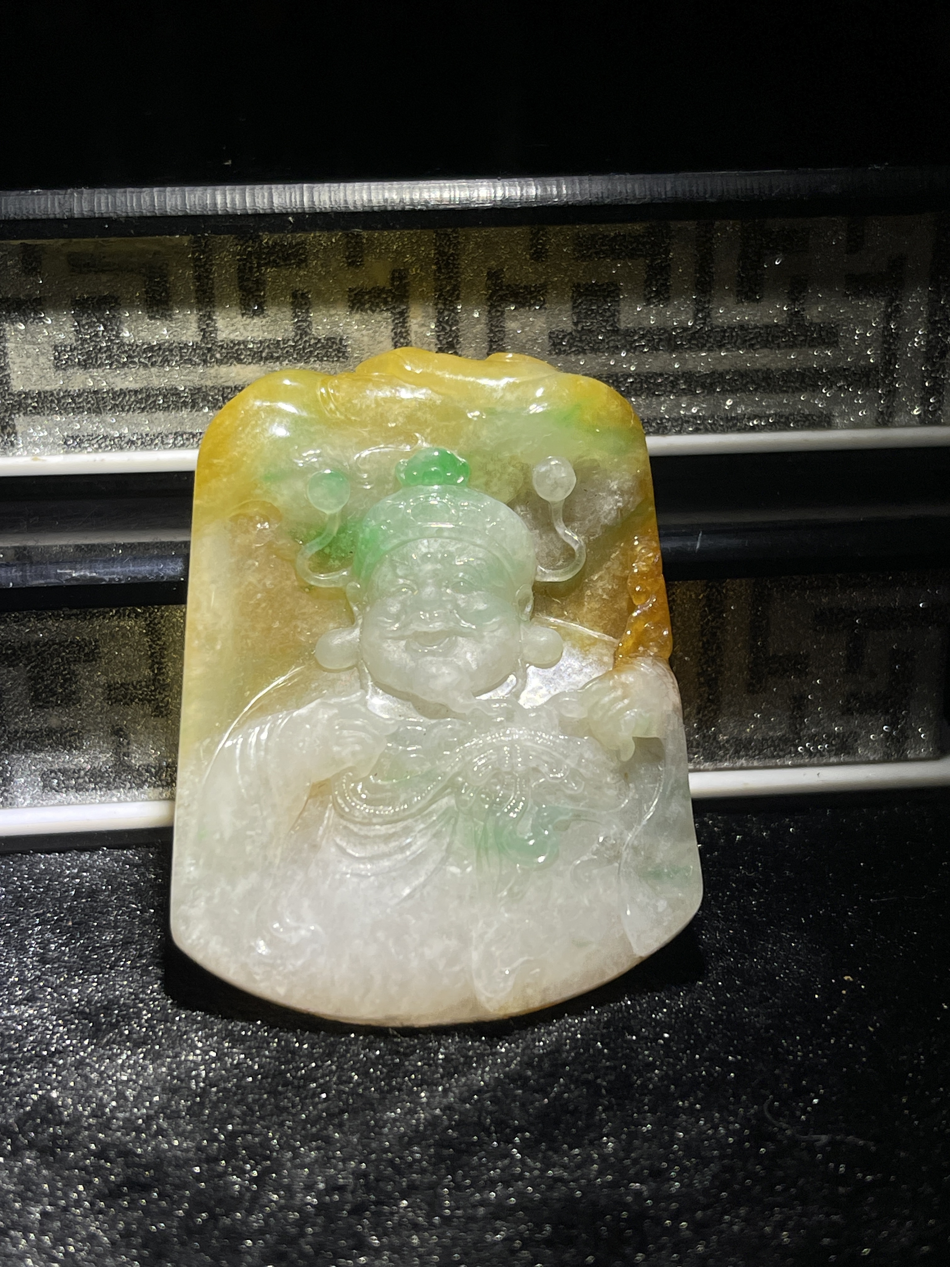 Yellow and green tri-colour jade Caishen amulet