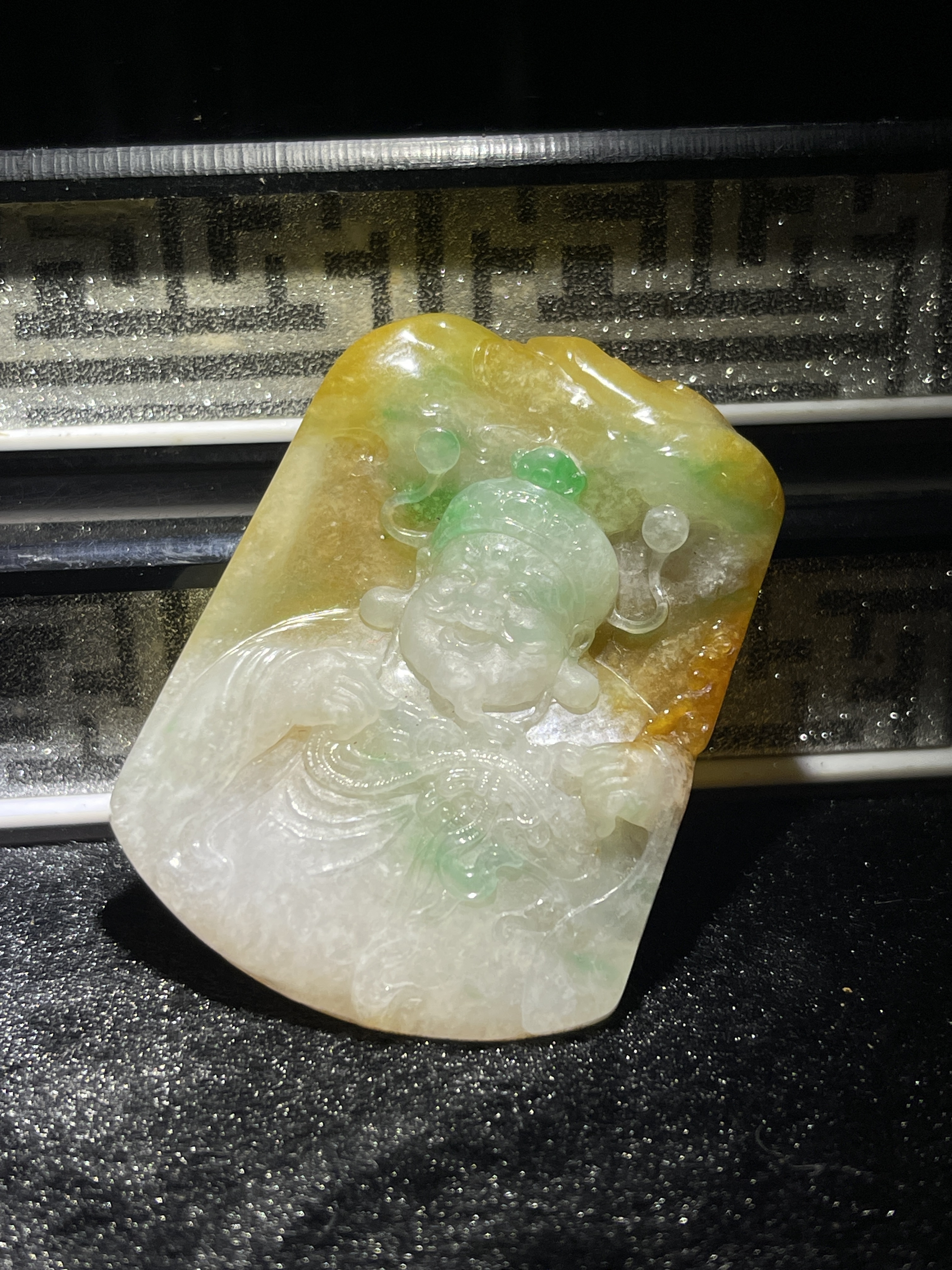 Yellow and green tri-colour jade Caishen amulet