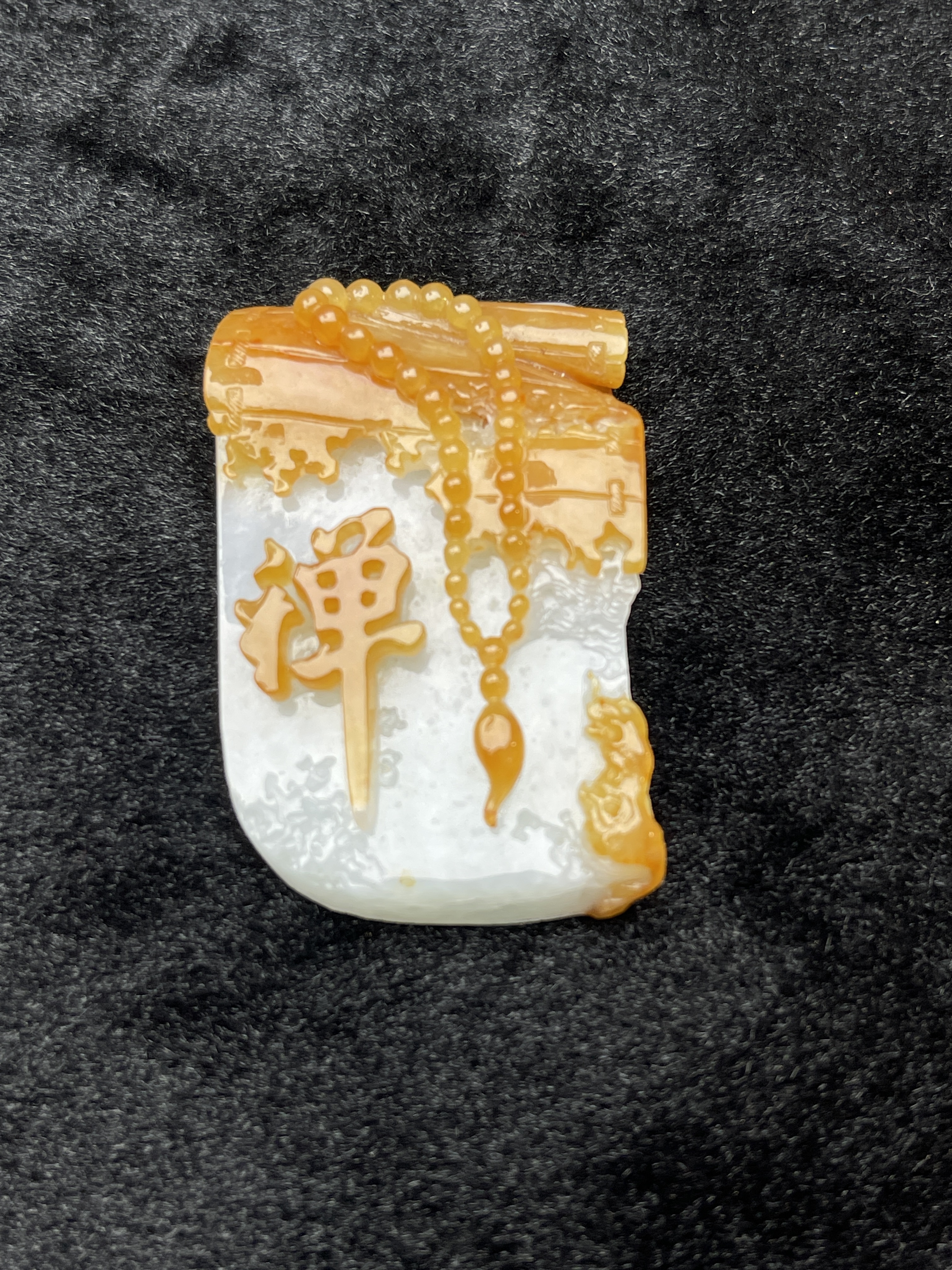 A scroll of scriptures tilts, a thought enters meditation The Dhamakan yellow jade shows a charming colour